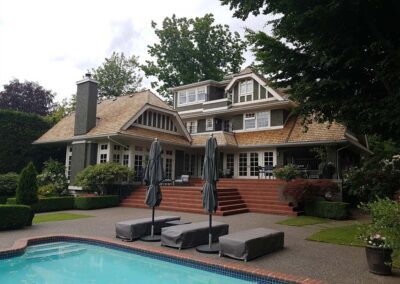Window, roof, gutters and pressure washed concrete stone walkways to beautiful restored home in Victoria with pool.